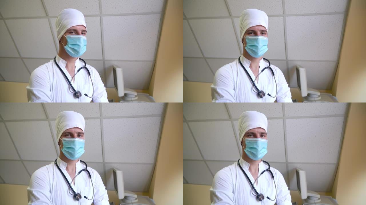 戴着口罩的听诊器的医生看着相机。背景上有超声设备的医院