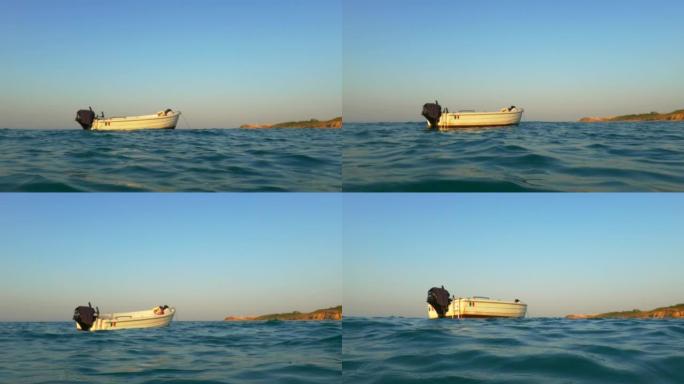无人驾驶的摩托艇在大海中起伏不定。低角度的观点