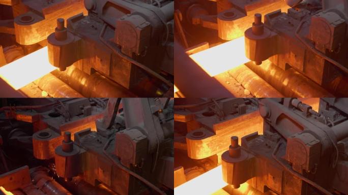 在生产中轧制金属，在热金属带上移动，球生产阶段，在金属轧制厂生产过程，通过闪闪发光的金属辊轧制