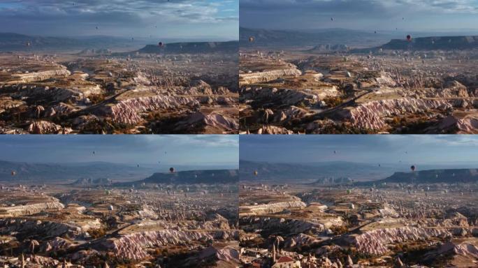 放大卡帕多西亚山谷驾驶汽车和飞行热气球的道路航拍画面