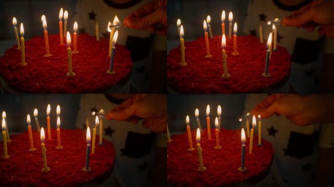 蛋糕上的蜡烛用火柴点燃度假。