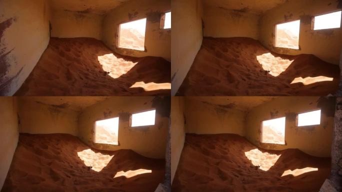 沙漠中部分充满沙子的废弃房间。