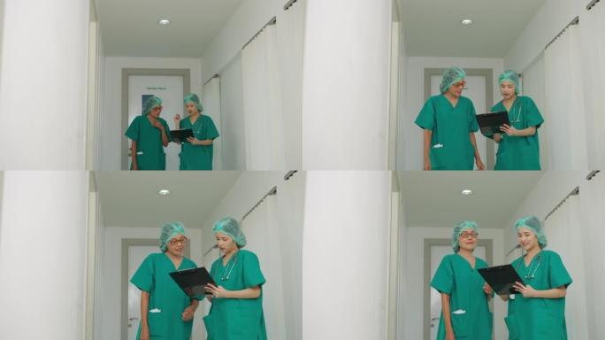 前视图外科医生团队交谈并走出手术室。