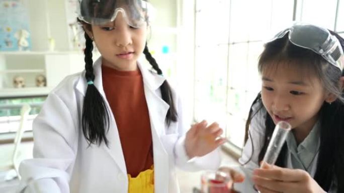 童年的学生和朋友在教室实验室学习科学，走进教室。