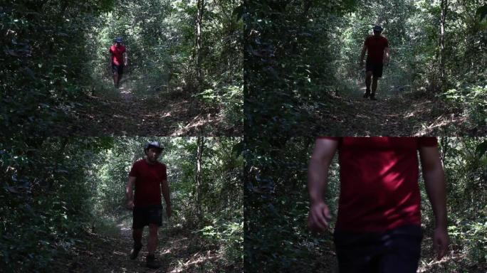 在米纳斯吉拉斯州贝洛奥里藏特附近的巴西乡村，一名男子向靠近塞拉多植被的隧道内的摄像机走去，拍摄的镜头