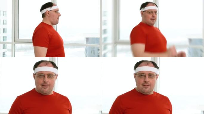 有趣的超重男子戴上头带，看着相机。高加索胖子表现出对健康生活方式促进的意愿和信心