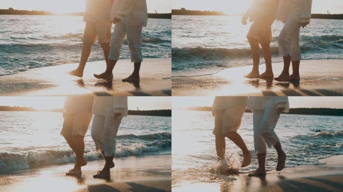 几个老成熟的人一起在沙滩上散步，在沙滩上玩耍，享受和生活的时刻。两个恋爱中的可爱前辈玩得开心。赤脚在