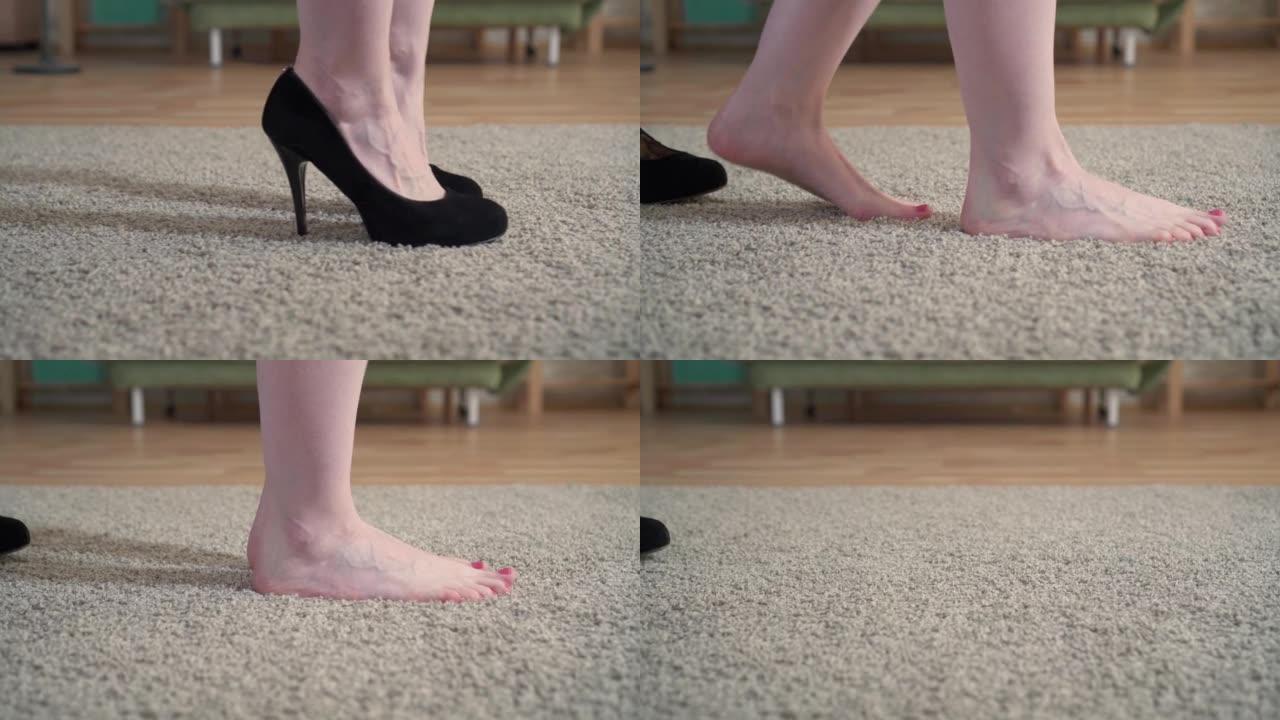 一个女人的特写镜头脱下鞋子，赤脚躺在地毯上