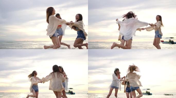 4k组亚洲女性朋友在夏季日落时在热带岛屿海滩上一起玩。