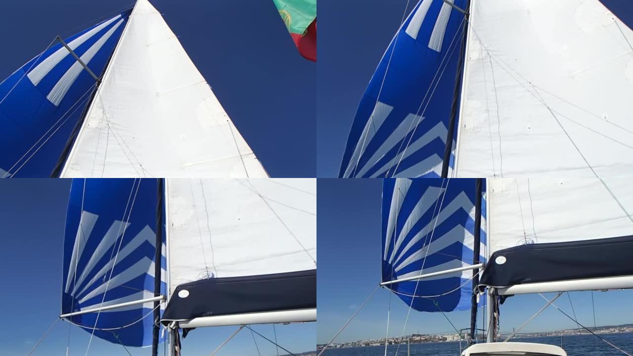 葡萄牙里斯本的Tage带白色和蓝色三角帆的帆船