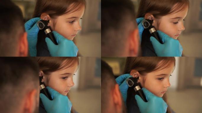 用耳镜对儿童耳朵进行4k视频特写检查。耳镜检查。拜访耳鼻喉科医生并咨询。