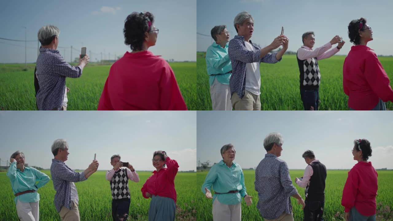 亚洲中国活跃的老年人在露营车汽车之家前欣赏风景稻田