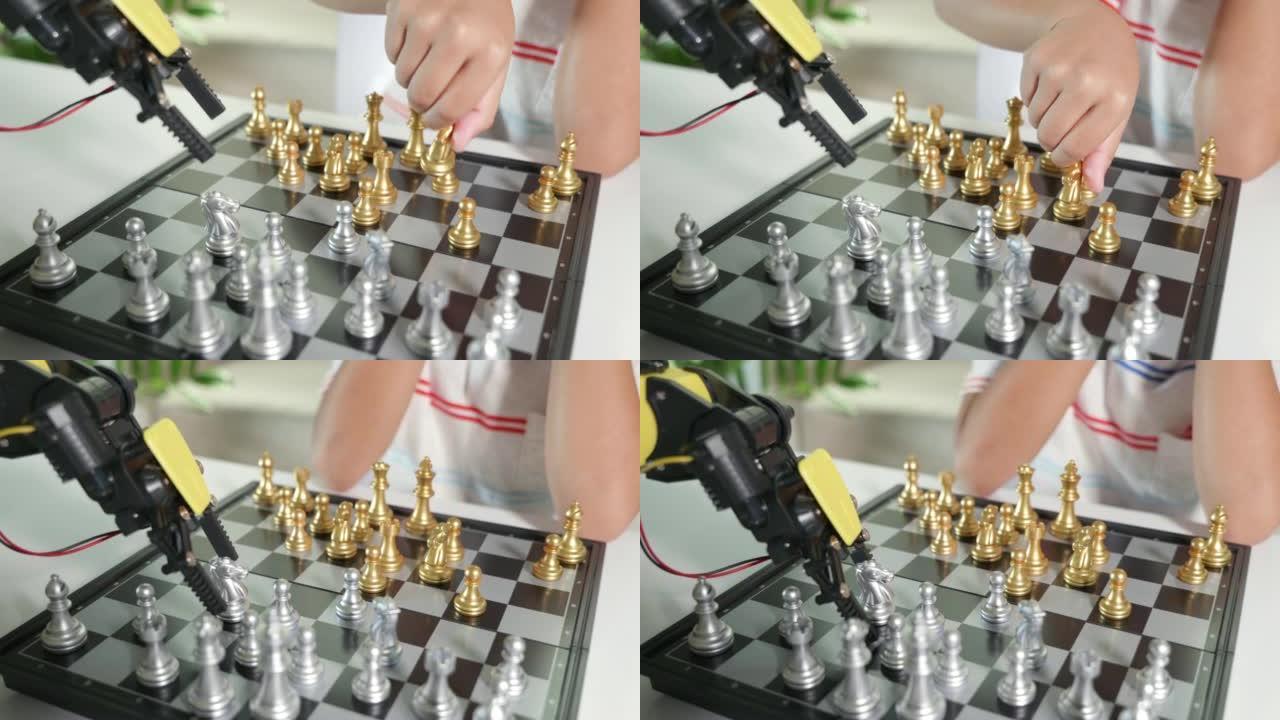 亚洲小男孩正在用机器人机器手臂下棋