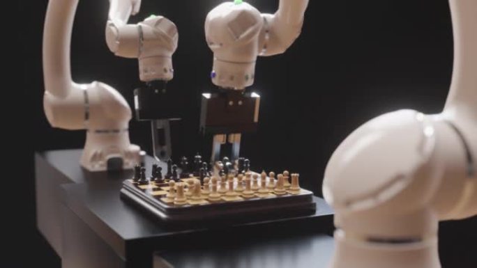 两只机器人手正在下棋。