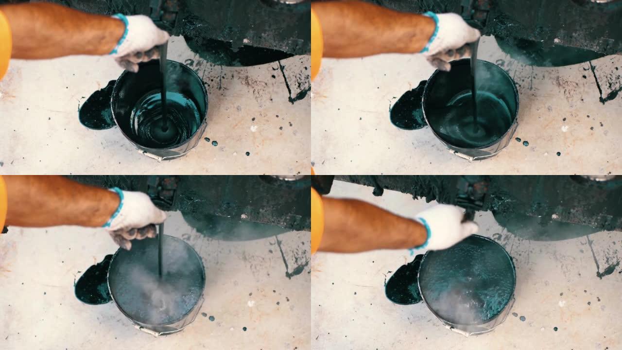 桶中的混合灰色混凝土和底漆-翻新。腻子溶液混合在黑色桶中。股票视频