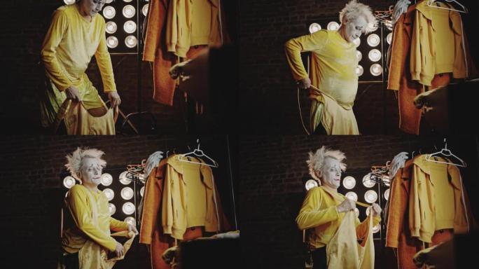 Mime穿上黄色舞台服装在马戏团表演