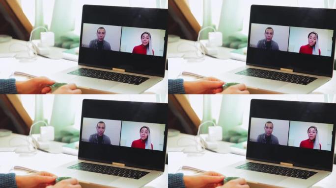 笔记本电脑屏幕上的商务人员视频会议
