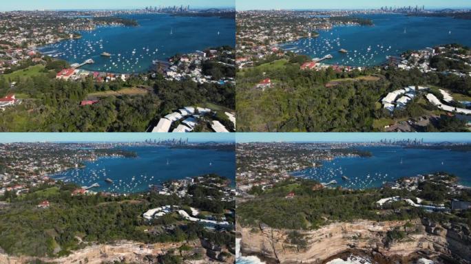 澳大利亚东悉尼屈臣氏湾的空中无人机回撤视图揭示了沿海悬崖顶
