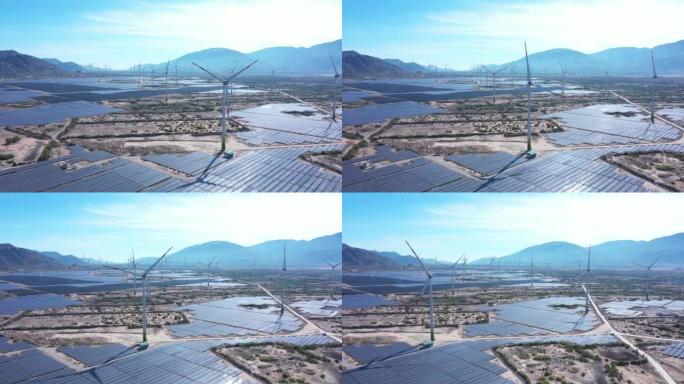 太阳能发电厂和风力涡轮机塔产生可再生能源的空中无人机镜头。减少全球变暖和气候变化的绿色能源概念。