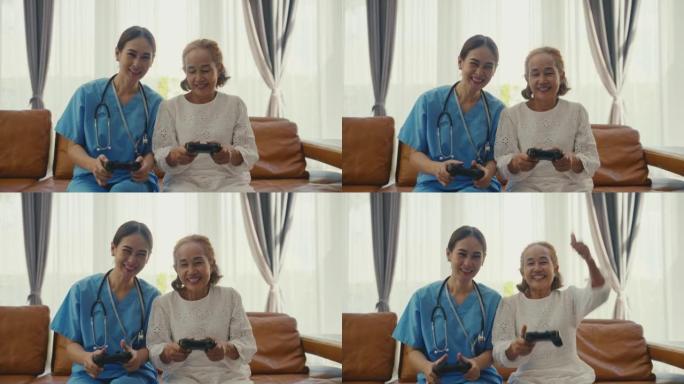 年轻的女性家庭护理人员和高级妇女在家里的客厅玩电子游戏