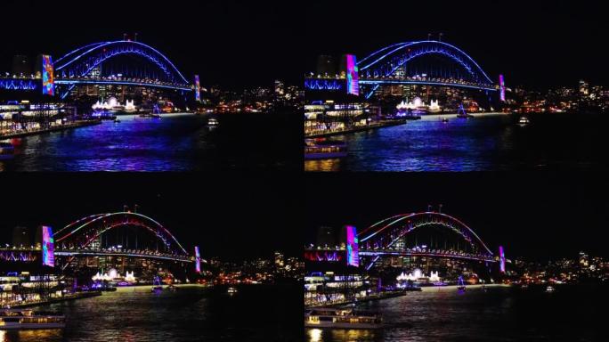 澳大利亚新南威尔士州悉尼港夜间的彩色灯光秀。用激光和霓虹灯照亮的桥