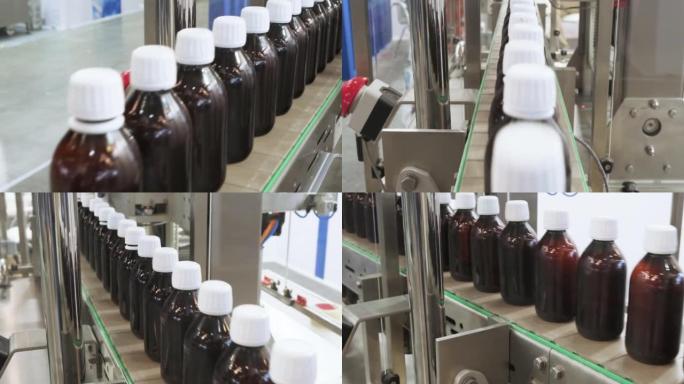 特写在制药厂4K DCI的传送带上连续包装液体药品或化妆品的许多玻璃瓶