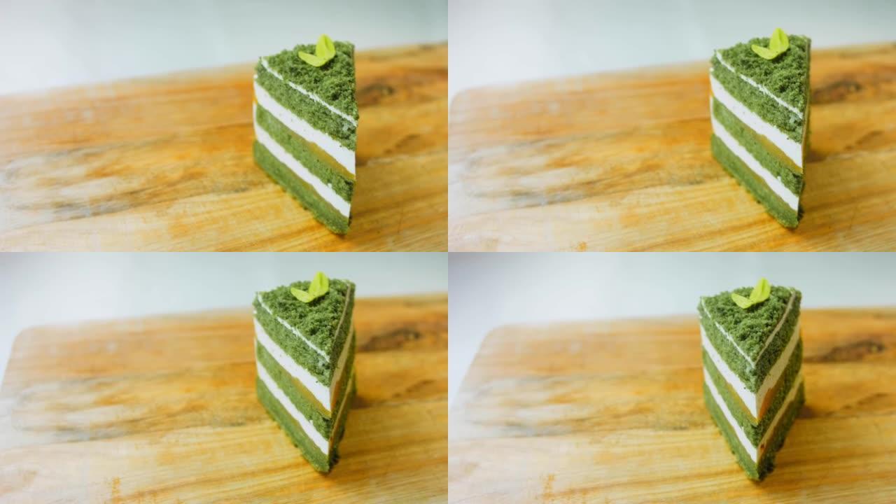 绿色巧克力叶子的绿色diushes蛋糕。微距和滑块拍摄