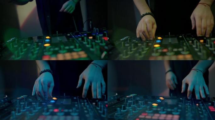 dj的手触摸按钮和滑块，使用混音控制器播放电子音乐，夜总会的摇摆派对。特写，慢动作