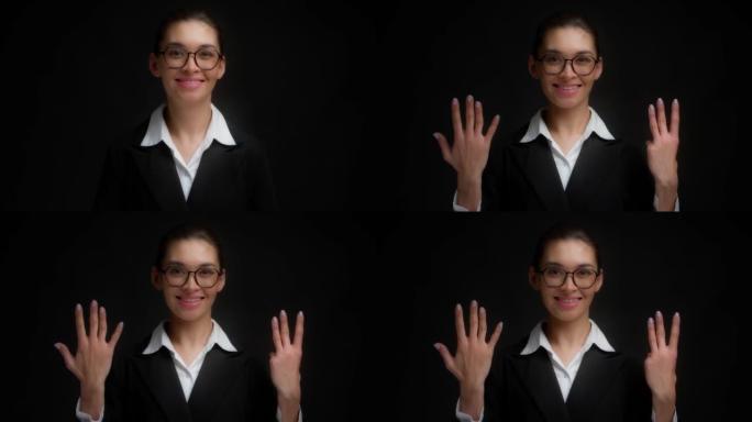 戴眼镜的亚洲女人微笑着用右手露出八个手指。
