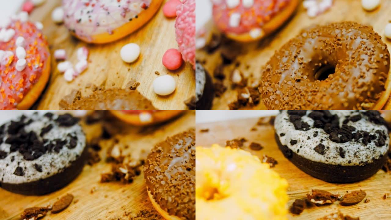 复古烤盘上的巧克力、棉花糖和糖果甜甜圈。甜甜圈在用天然巧克力装饰的纸上。微距和滑块拍摄。各种彩色甜甜