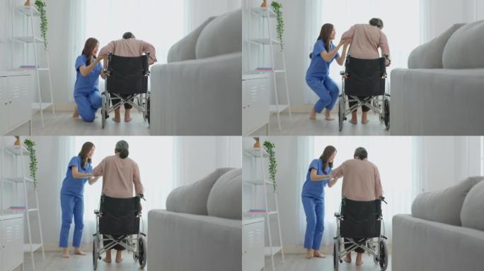 亚洲护士在疗养院照顾轮椅上的高级妇女。迷人的快乐护理员女孩医生支持老年成熟女性病人在客厅。医疗保险概