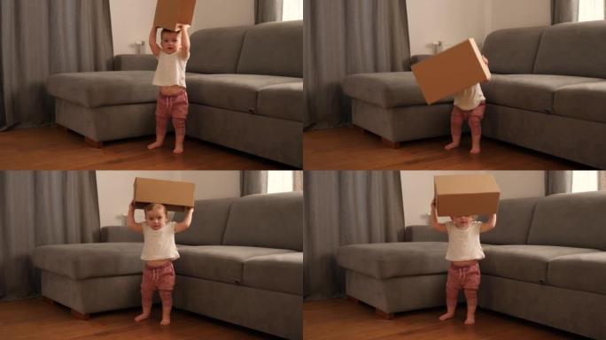 家里的小女孩玩纸板纸箱 -- 好奇和认知的童年