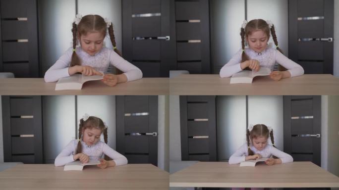 这个女孩用一本书做作业。女孩在家学习，坐在桌子旁看书