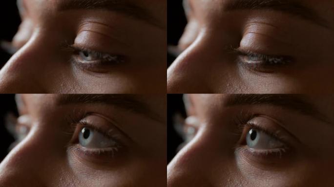 白种人女性模特眨眼的蓝眼睛的宏观镜头