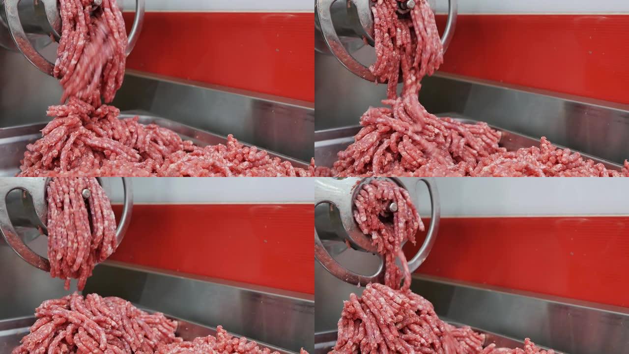 电动工业绞肉机将肉加工成中等脂肪含量的碎肉。肉类和内脏的零售。特写。