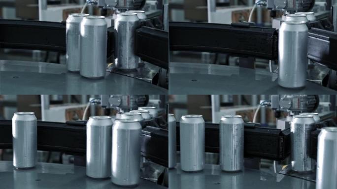 用于饮料加工的新铝罐正在饮料制造的传送带机上的工厂生产线上移动。食品饮料工业经营理念。高质量4k镜头