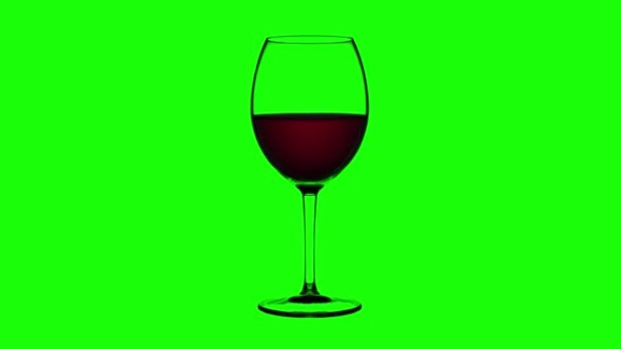 空杯子装满绿色背景上的红酒