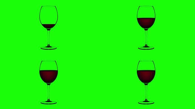 空杯子装满绿色背景上的红酒