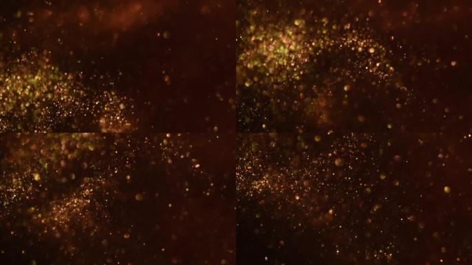 金色粒子在黑暗流体中的抽象波浪运动。