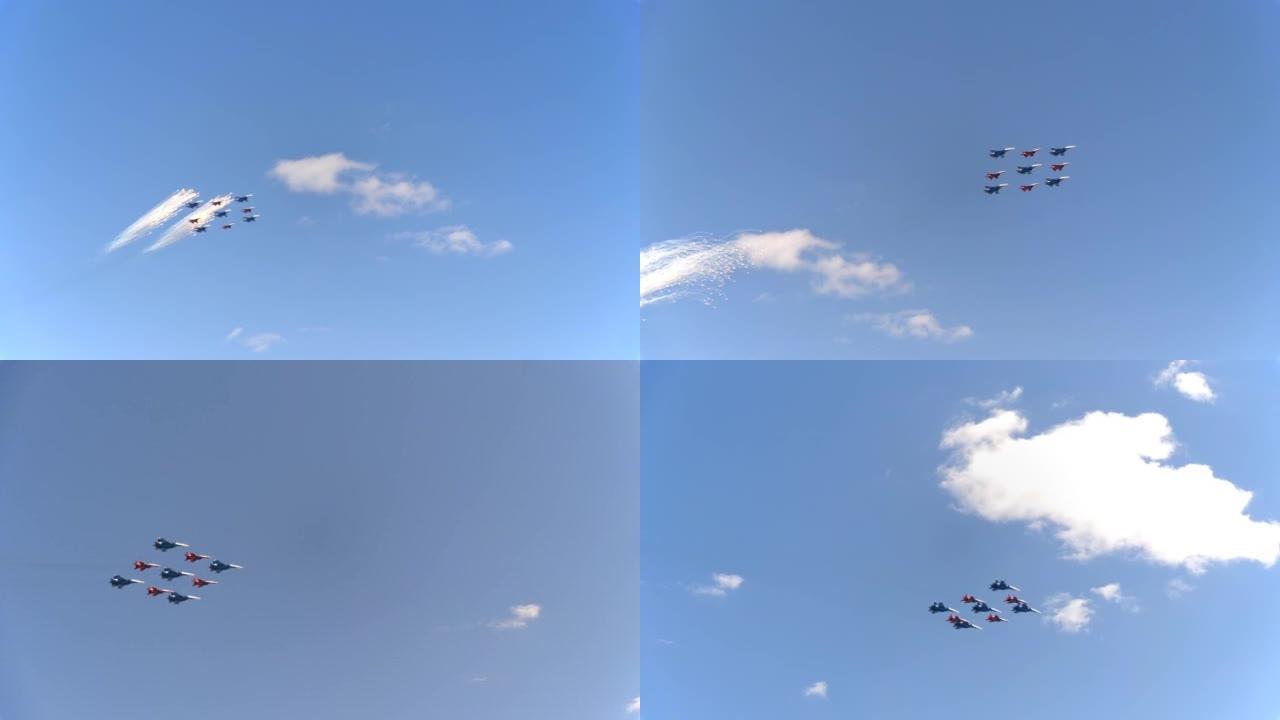 战斗机Su-35 (侧翼-E) 和米格-29 (支点) 衬有钻石苍蝇，烟花在天空中飞舞