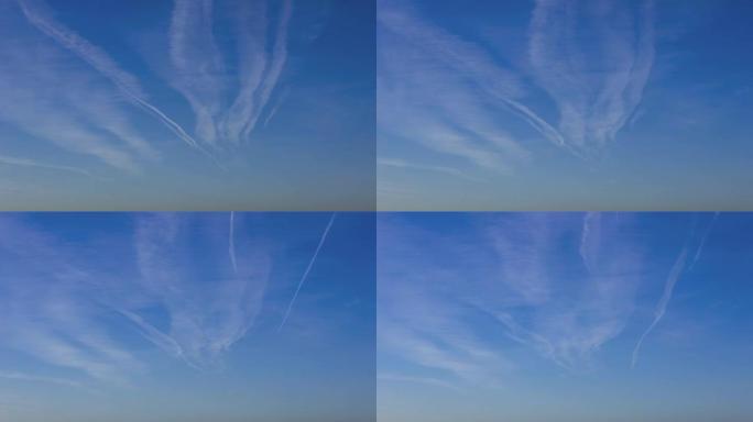 飞机轨迹与蓝天的时间间隔。喷射平面冷凝轨迹