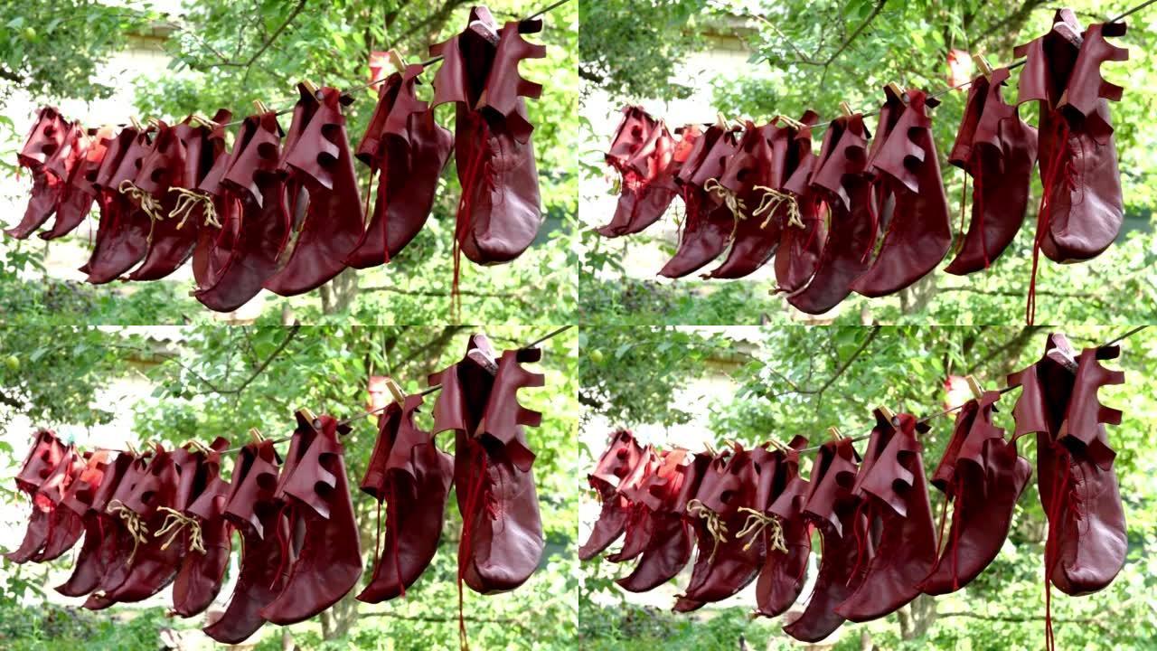 特殊的戏剧皮革小丑鞋在后院清洁后干燥或通风。