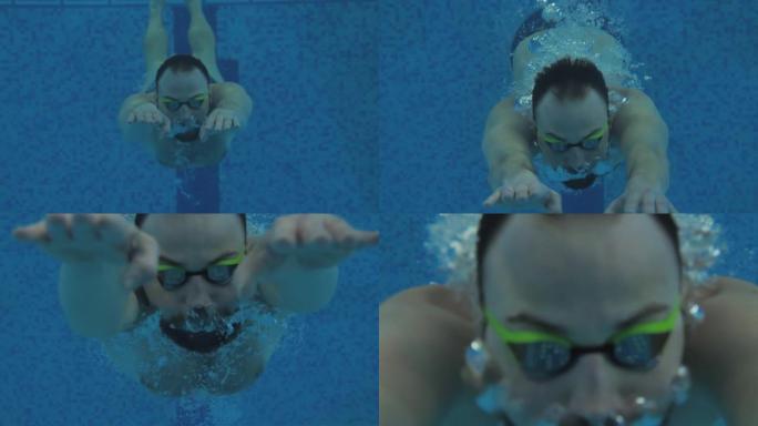 在游泳池进行护目镜训练的男性游泳者的水下肖像。游泳与运动概念