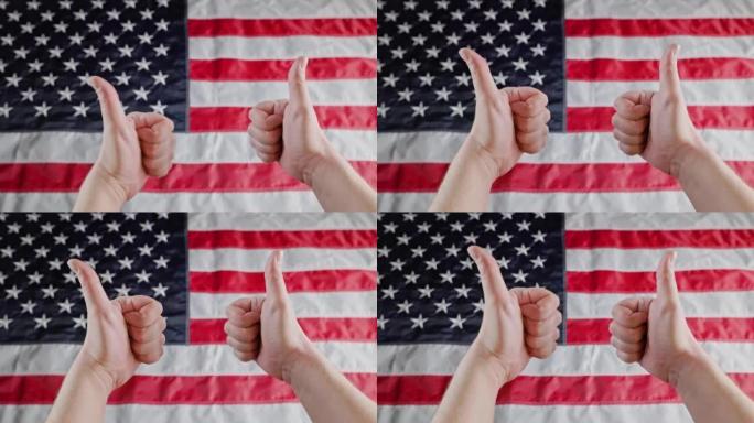 两个白人的手在模糊的美国国旗前竖起大拇指