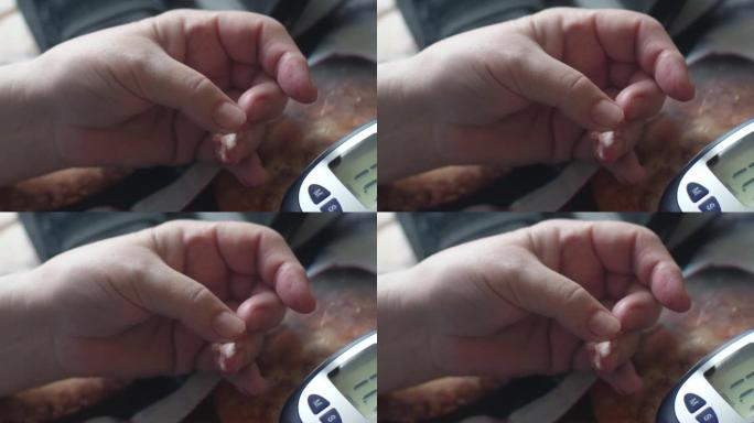 特写镜头在一名女性血糖仪的手中，一名养老金领取者使用家用血糖仪测量血液中的糖水平。2型糖尿病。选择性
