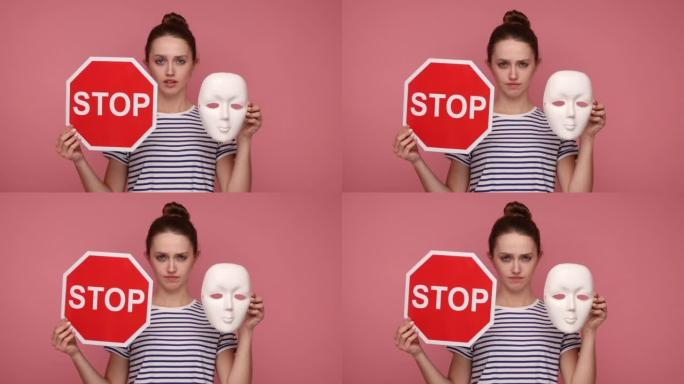 手持白色口罩的女子对着镜头示意停止，并点头表示不，不要改变个性。