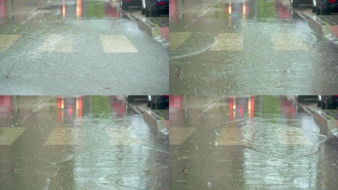 汽车穿过街道，从雨水形成的巨大水坑中溅起水