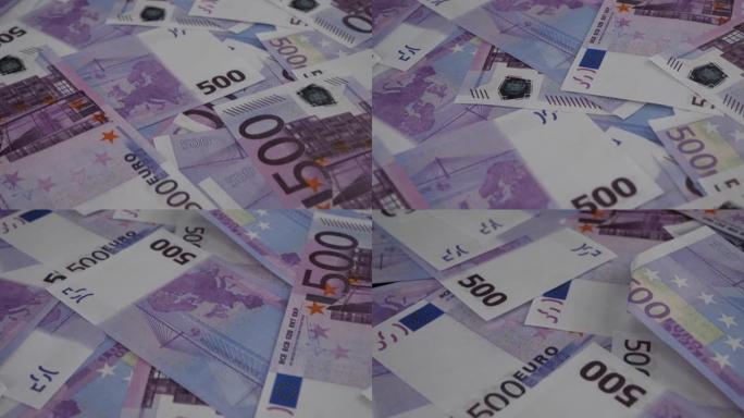 一道道欧元钞票平铺在桌子上。欧元纸币上的固体声子。大量的欧元堆积如山。财务福利的概念。