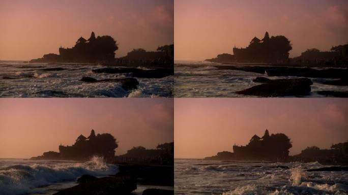 傍晚，印度尼西亚巴厘岛的丹那·洛特神庙 (Tanah Lot temple) 在海波撞击岩石。