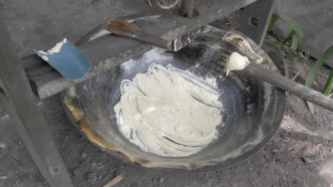 close up of palm sugar paste inside a wood cooking